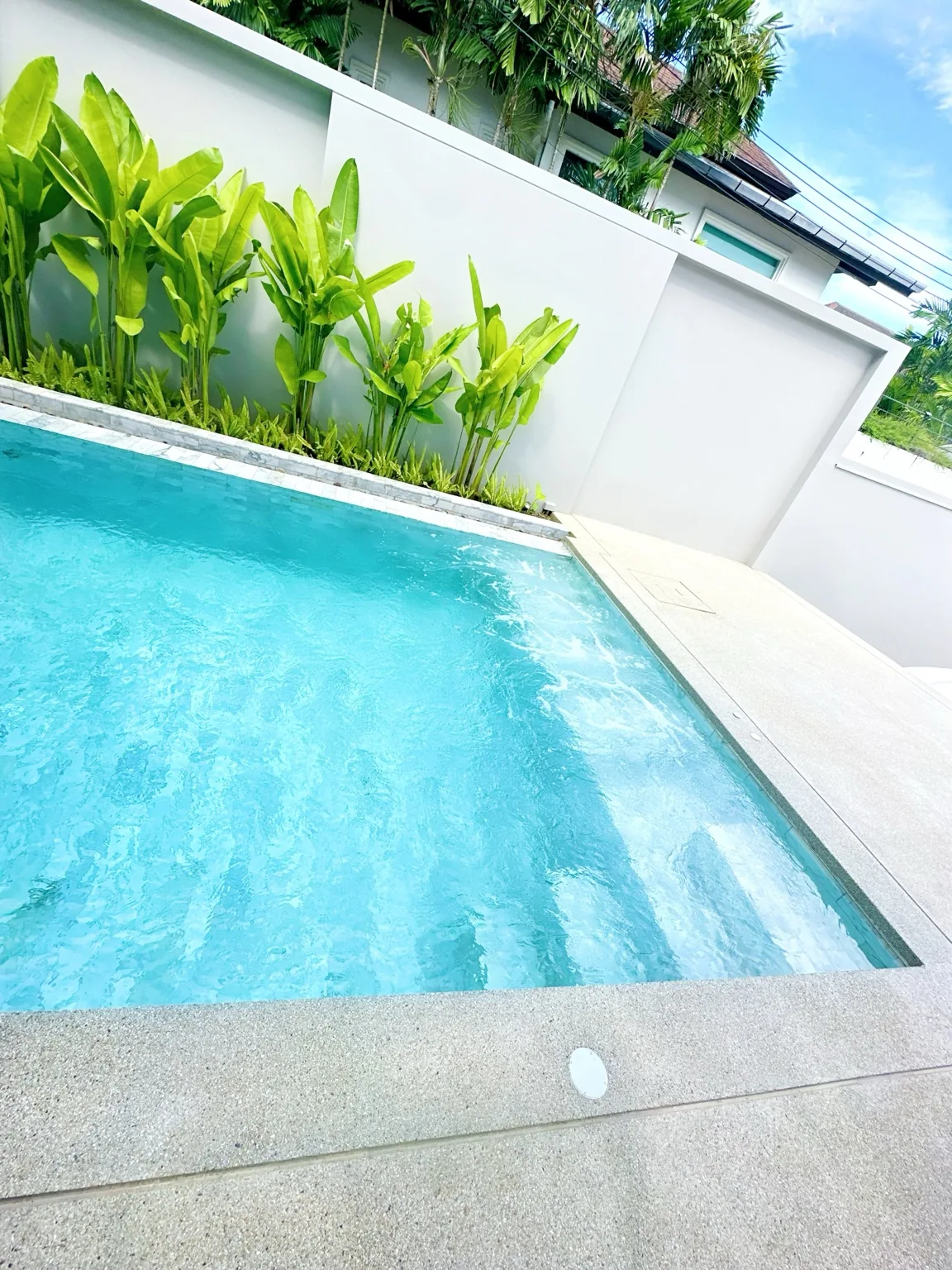 Private poolside terrace at Charm Pool Villa Honeywood, Rawai Phuket, with space for outdoor lounging